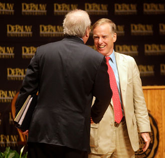 Howard Dean and Karl Rove shaking hands